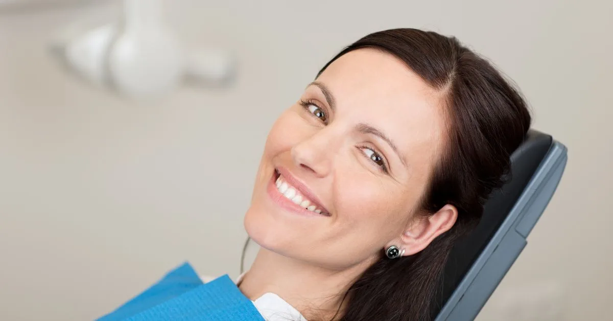 adult at her dentist for a dental cleanings with braces